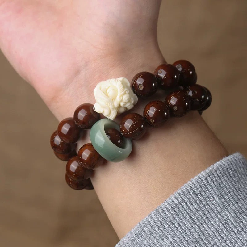 Natural Red Sandalwood Bodhi Seed Carved Lion Bracelet